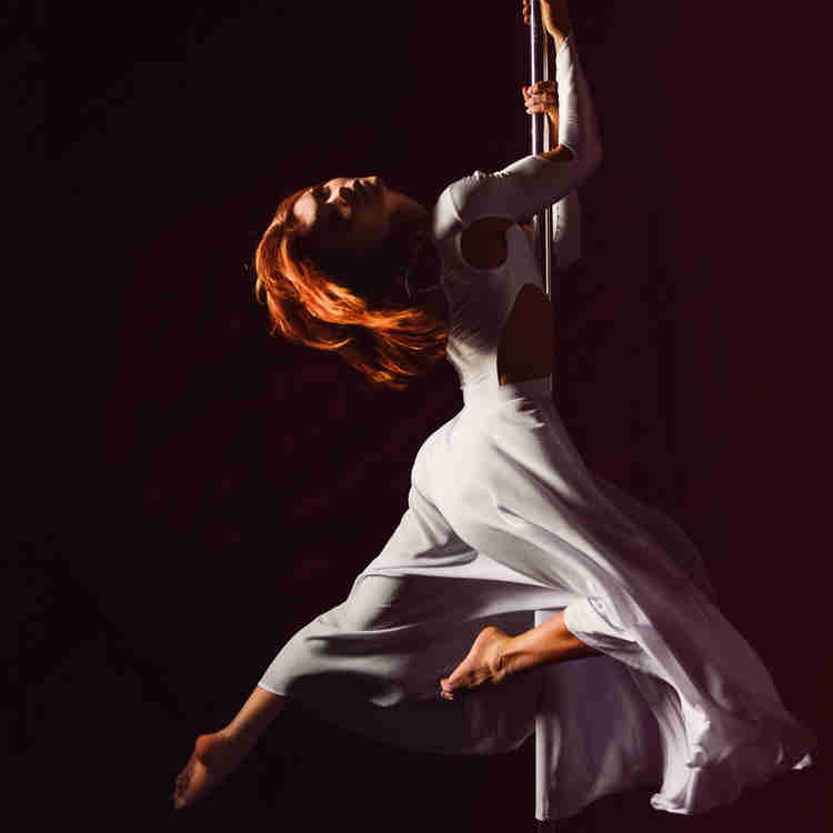 Dance in dress at dance barre. 